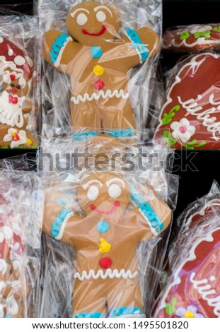 Gingerbread man figurine during food festival named "La Pas pe Calea Victoriei". Ginger bread sweet dessert on a stick for kids, candy and lollipops