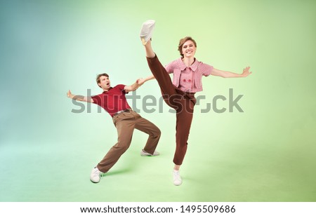 Dancing lindy hop couple in motion