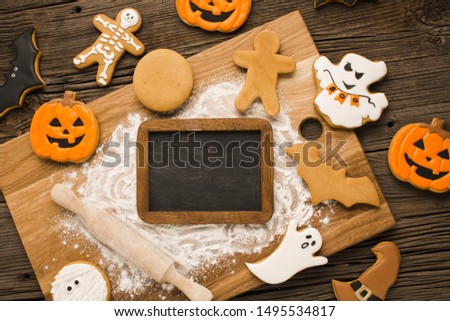 Halloween cookies on a wooden board