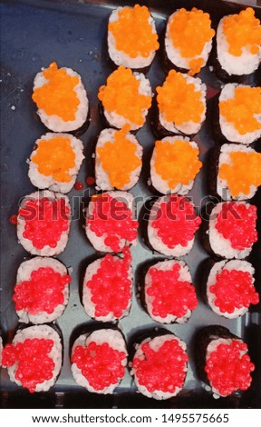 Variety of colorful shrimp eggs and sushi available at general market