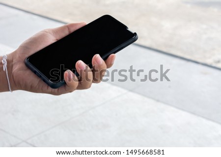 Hands holding smart phone with blank screen - Cropped image
