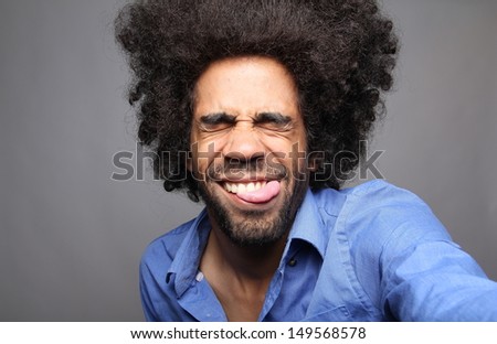Happy afro man in a photo booth