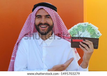 Arabic businessman with full wallet 