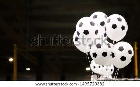 festive soccer balloons on a dark background