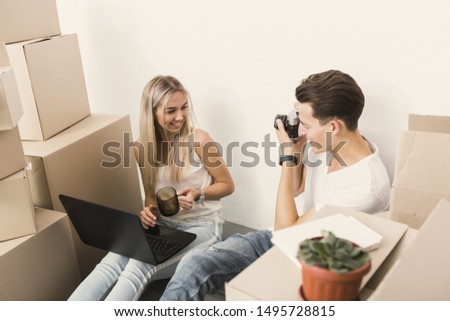 Young man taking picture of girl