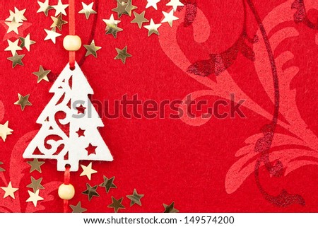 Red Christmas Background with Handmade Tree, Golden Stars and Ornament / copy space for your text