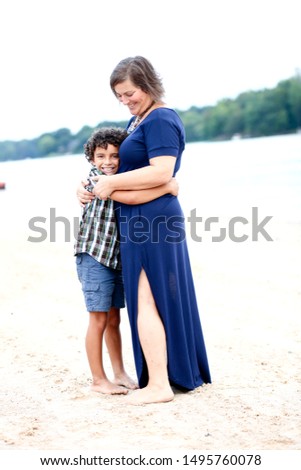 Beautiful biracial African American black Mother Son pictures together at lake beach in the summer
