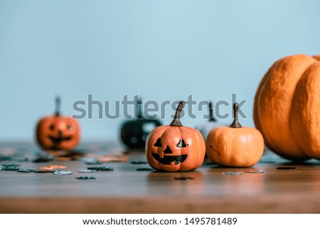 
Preparing for Halloween day with pumpkin Jack O'Lantern on wooden table, design with copy space for text, advertising and banner.