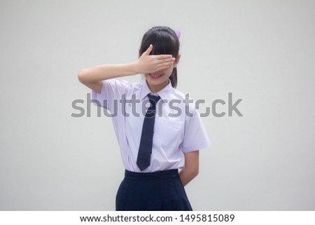 Portrait of thai Junior high school student uniform beautiful girl not look