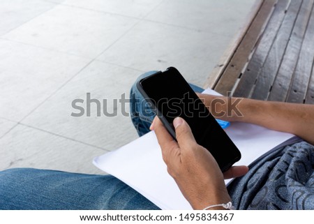 Hands holding smart phone with blank screen - Cropped image