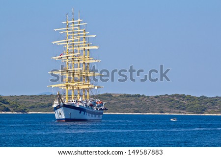 Big Ancient Ship In Blue Deep Sea. High quality stock photo.