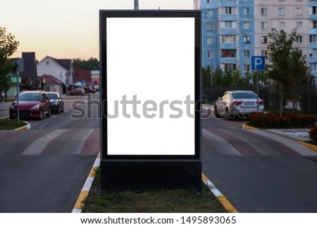 advertising space under the poster. Lightposter citylight mockup small billboard in the city near the roadway. white space for advertising