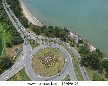 An aerial view of Kota Kinabalu city of Sabah incuding building, sea and road.