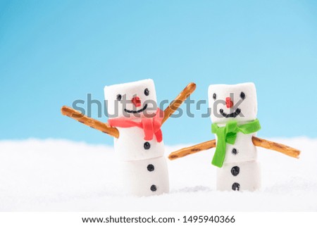Funny Cute Marshmallow Snowmans. Fun Outdoor Games in Snow .
