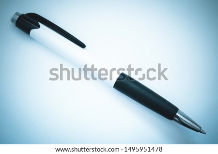 pen on a table in office