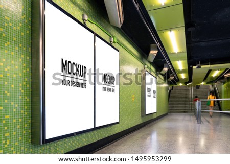 Blank billboard located in underground hall or subway for advertising, mockup concept, Low light speed shutter