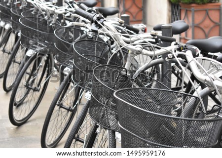 Front view of shared rental bicycles parked on the street. Ecological transport concept