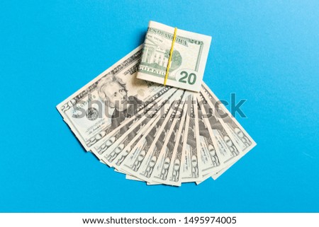 A Hundred dollar currency fan close up, Top view of business concept on colored background with copy space.