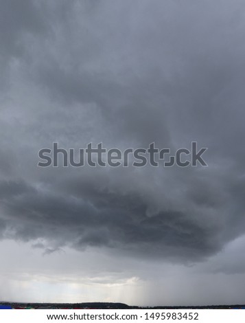 Rain clouds.
Photography, atmospheric phenomena, panoramic image of the summer sky.