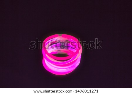 New colors of glow sticks for night party, on black background. Horizontal picture