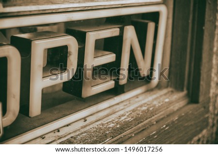 Open sign. Neon with wooden background.