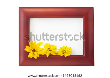 Brown wooden photo frame with yellow flowers on a white background. Hello autumn card. Home interior decor, mockup, space for text. Beautiful nature, vintage colors, minimal style concept. Copy space.