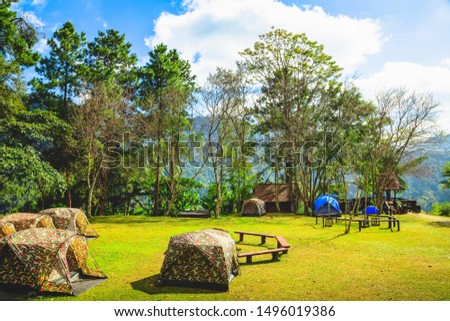 Beautiful landscape of camping tents on campground at Doi Phu Kha National Park, Nan Province, Thailand. Multiple viewpoints to sightseeing and taking a photo at sunrise and sunset. Travel Concept.