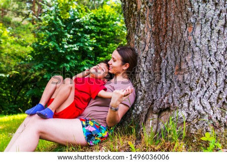 mother and son having fun in nature