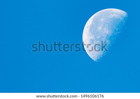 Half moon silhouette daylight blue