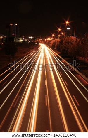 Car Light in Road at Night Long Expousure