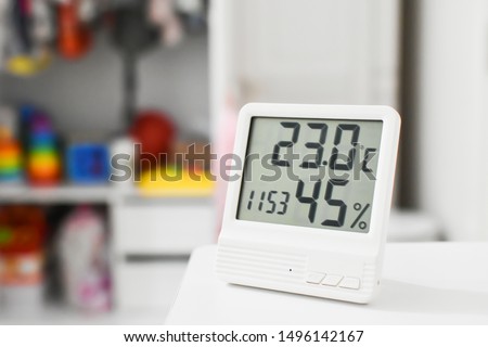 Digital clock, thermometer and  hygrometer for nursery or children room.  Royalty-Free Stock Photo #1496142167
