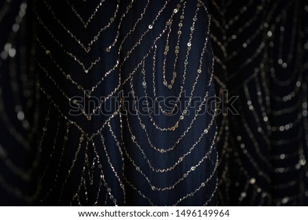 Navy blue fabric embroidered with sequins