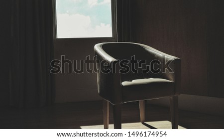 Empty chair in the dark room