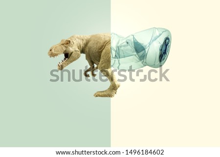 Creative concept background by photo of dinosaur ( toy model)  stuck in transparent blue plastic bottle ,with pastel color toned.