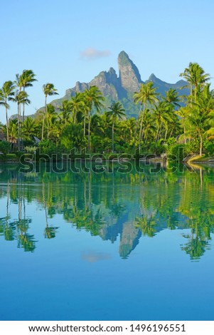 View of the Mont Otemanu mountain reflecting in water at sunset in Bora Bora, French Polynesia, South Pacific Royalty-Free Stock Photo #1496196551