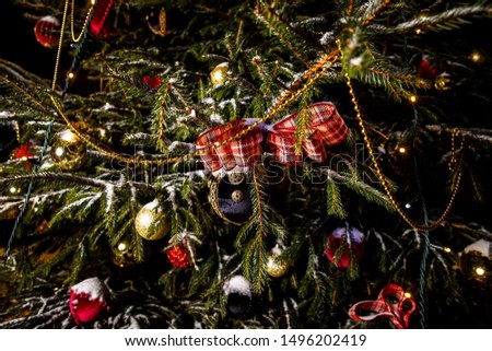 Christmas background - baubles and branch of natural spruce tree