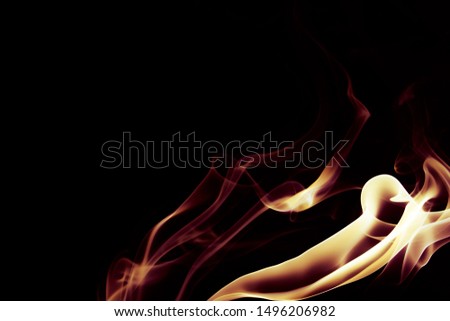 Incense smoke on a black background. A fiery flame style.