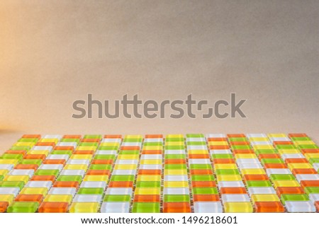 Warm-colored multi color tiles. Construction material texture.