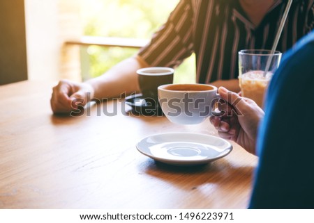 Closeup image of people enjoyed drinking coffee together