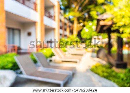 Abstract blur and defocused outdoor swimming pool in hotel and resort