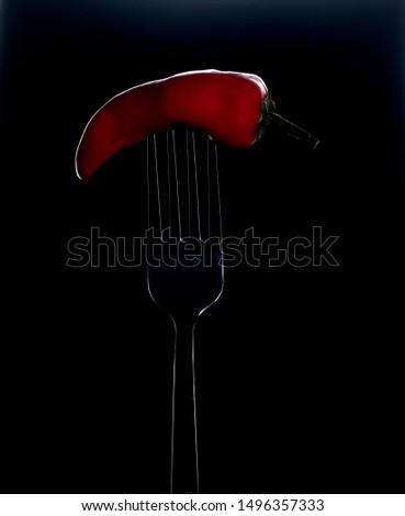 red chili peppers on a fork
