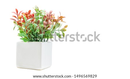 Vases of flowers, Artificial orange and green flower bouquet with white vase for home or party decoration isolated on white background. Copy space, Selective focus.