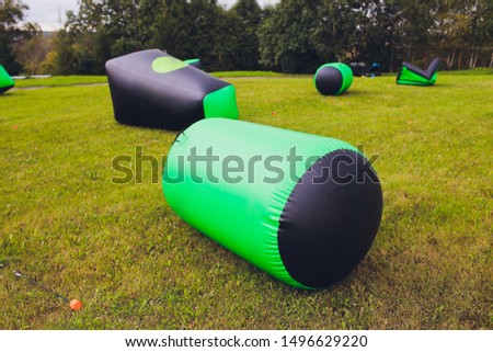 part of a large color inflatable children's attraction in the grass in the park.