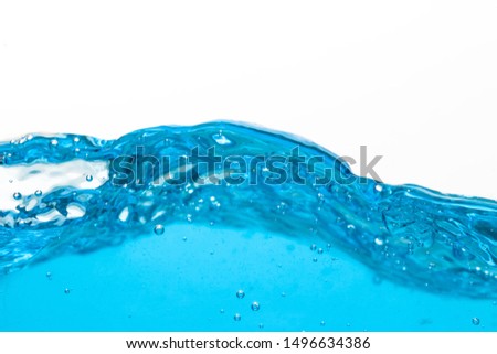 Waves of blue water with soap bubbles