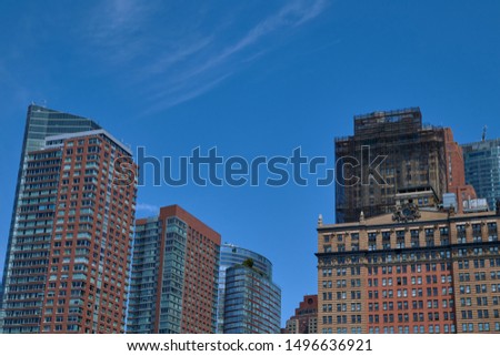 Photo of red and blue buildings in the city