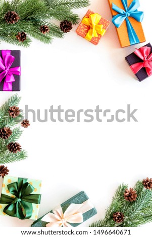 Presents for christmas in boxes and spruce frame on white background top veiw copyspace