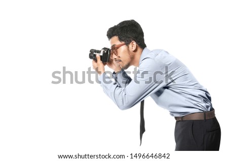 Asian businessman take a picture with his camera isolated over white background