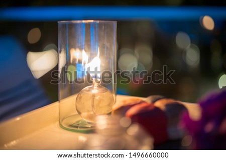 Candle light vase on dinner table settings