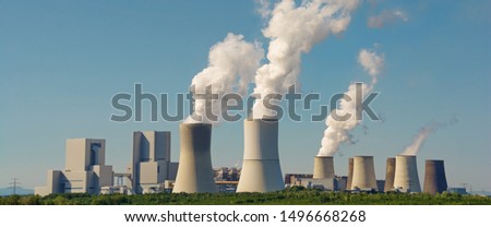 Modern coal power plant with blue sky as background, panoramic format Royalty-Free Stock Photo #1496668268