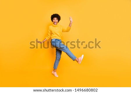 Full length body size view of her she nice attractive cheerful cheery playful comic wavy-haired girl having fun free time fooling isolated on bright vivid shine vibrant yellow color background